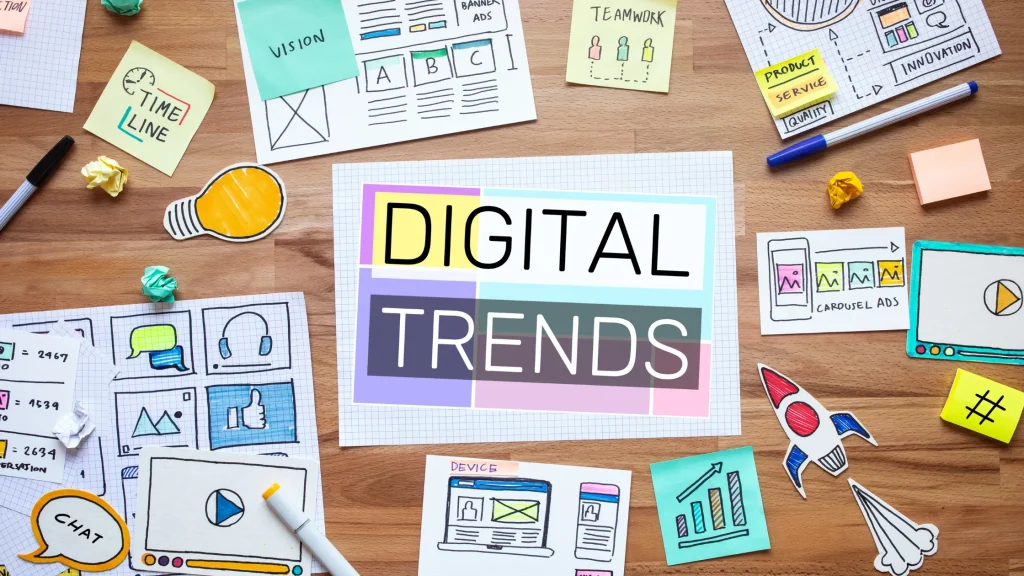 Creative workspace showcasing digital trends for 2025 with visuals of charts, devices, and digital marketing elements.