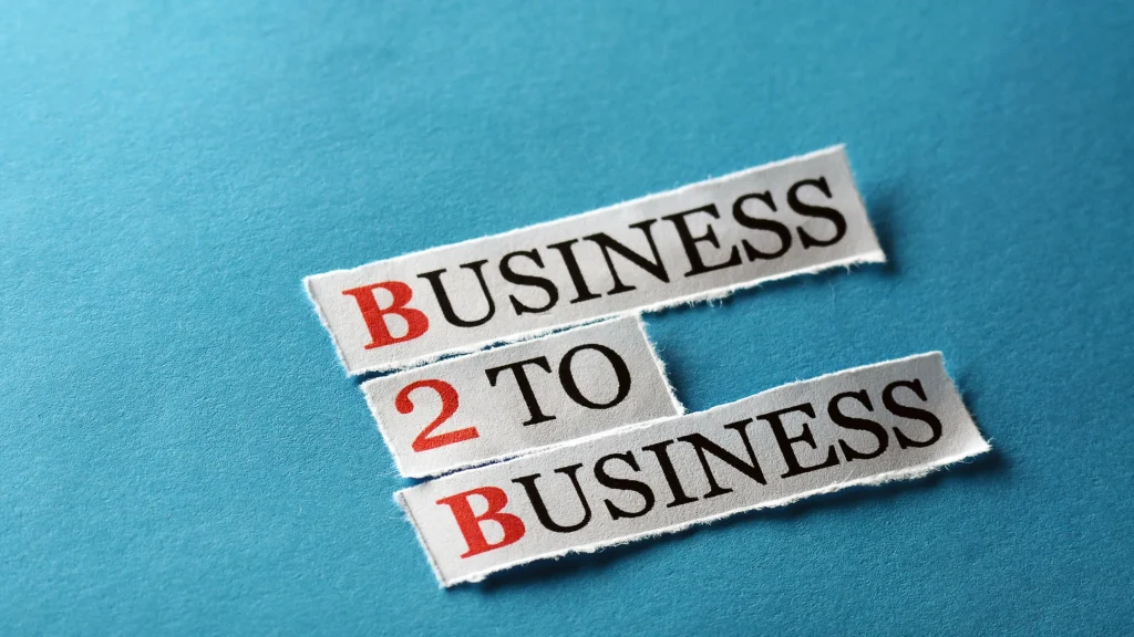 B2B Digital Marketing Strategies written in paper strips, emphasizing business-to-business marketing concepts.